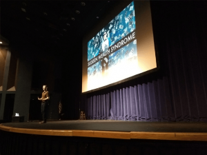 Comedian Colin Ryan performs for Financial Literacy Month